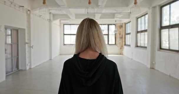 Camera Blonde Woman Walking Industrial Interior Closeup — Video Stock