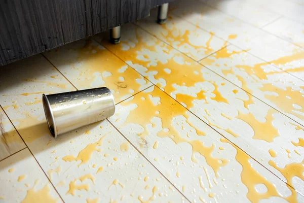 Spilled out drink on the floor close up photo