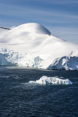 Hills covered with snow in Antarctica clipart