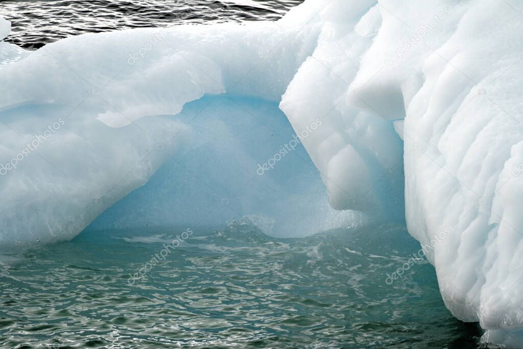 Antarctica - Non Tabular Iceberg Drifting In The Ocean - Antarctica In A Cloudy Day. Global warming
