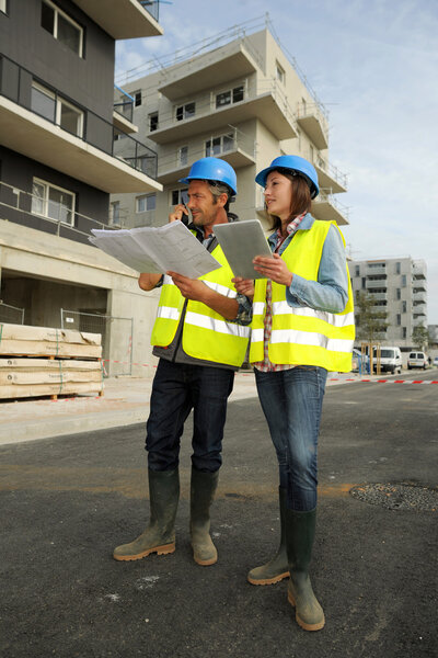 Engineers working on construction site