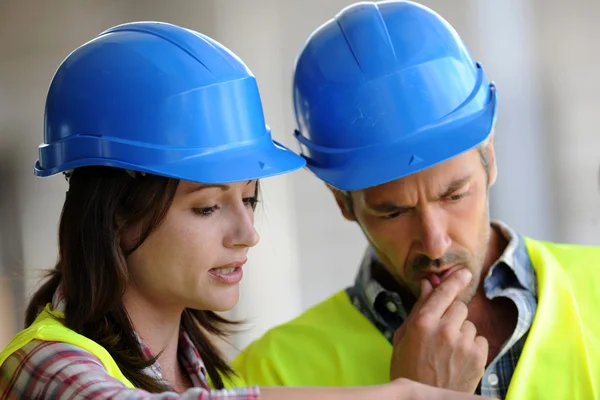 Closeup of construction with blue security helmet — Stock Photo, Image