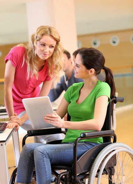 Handicapped person at work with electronic tablet — Stock Photo, Image