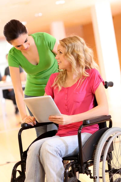 Handicapped person at work with electronic tablet — Stock Photo, Image