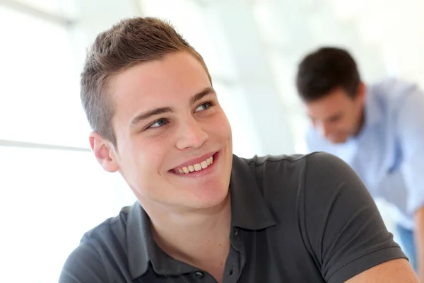 Portrait of cheerful student boy in class — Stock Photo, Image