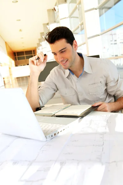 Young man studying at university — Stock Photo, Image