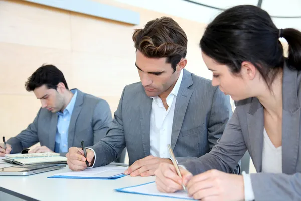 Young signing application form — Stock Photo, Image