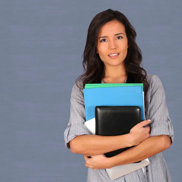 Student holding pile of files — Stock Photo, Image