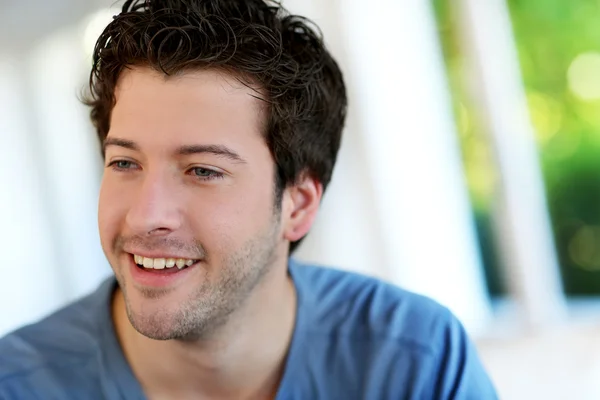 Portrait of cheerful young guy with blue eyes — Stock Photo, Image