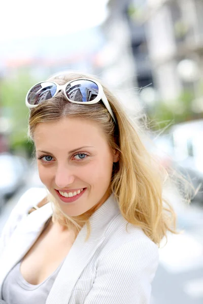 Portrait of beautiful blond girl in town — Stock Photo, Image