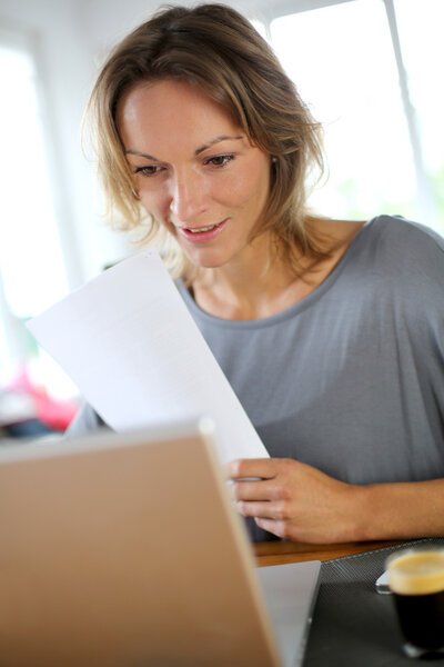 Woman working on laptop from home