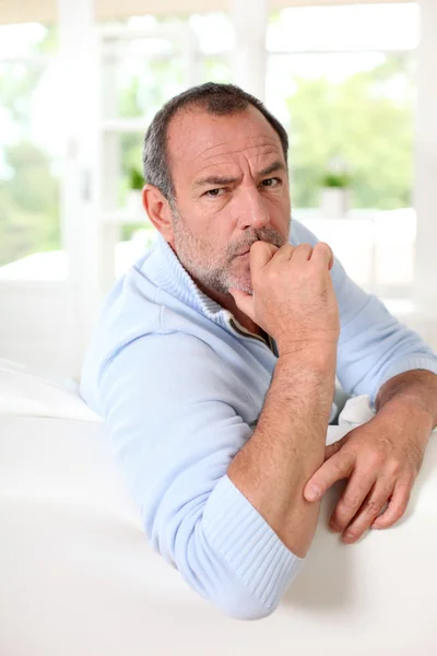 Portrait of senior man with interrogative expression on his face — Stock Photo, Image