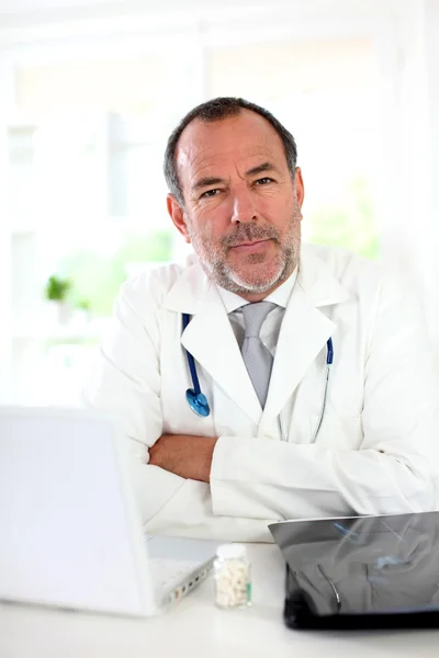 Portrait of mature doctor in uniform — Stock Photo, Image
