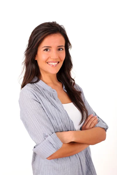 Young woman standing with arms crossed on white background Stock Image