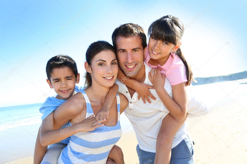 Closeup of happy family at the beach