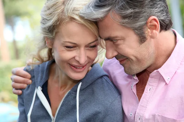 Portrait of middle aged couple looking at each other — Stock Photo, Image