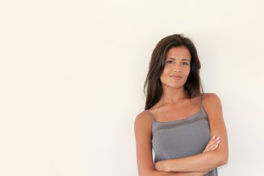 Charming young woman standing on white background, isolated