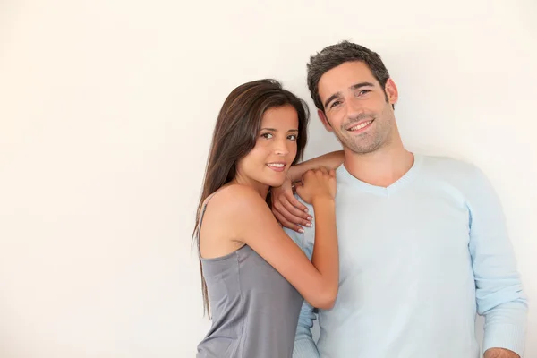 Trendy couple standing on white background — Stock Photo, Image