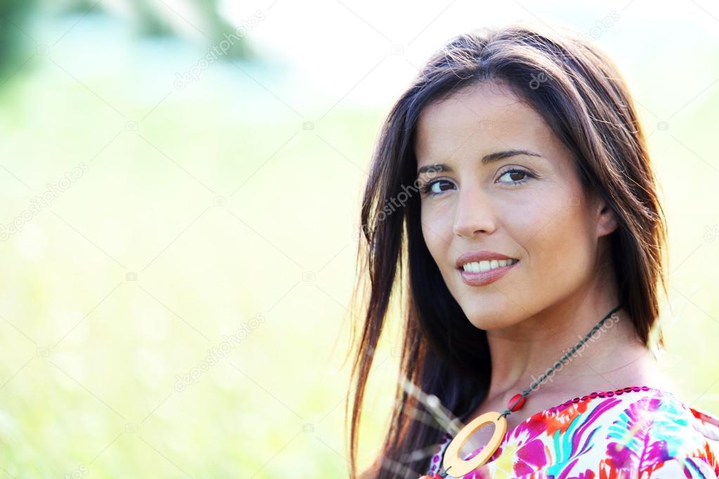 Beautiful young woman in nature