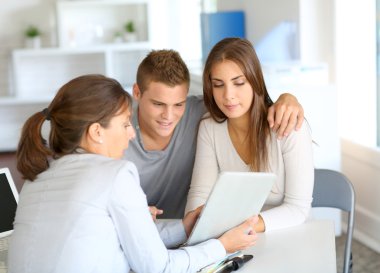 Young couple meeting financial consultant for credit loan clipart