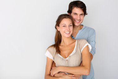 Cheerful young couple standing on white background, isolated clipart