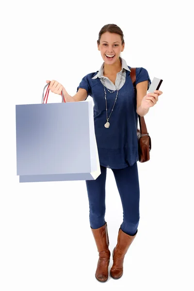 Trendy young girl holding shopping bags, isolated — Stock Photo, Image