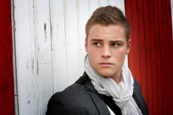 Portrait of young man standing on garage door — Stock Photo, Image