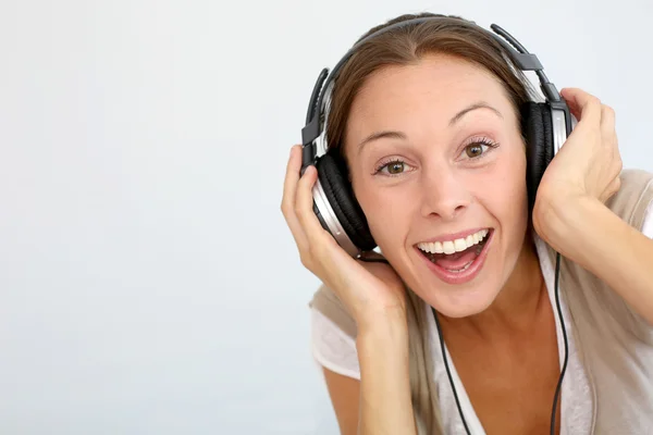 Mulher alegre com fones de ouvido, isolado — Fotografia de Stock