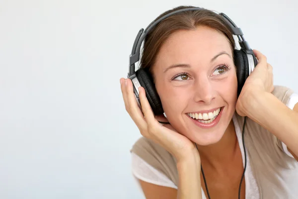 Mulher alegre com fones de ouvido, isolado — Fotografia de Stock