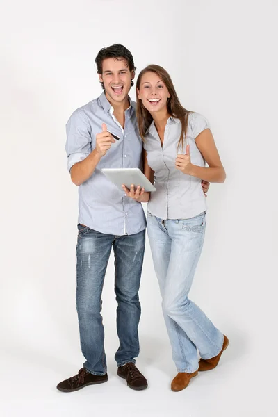 Young couple doing shopping on internet — Stock Photo, Image