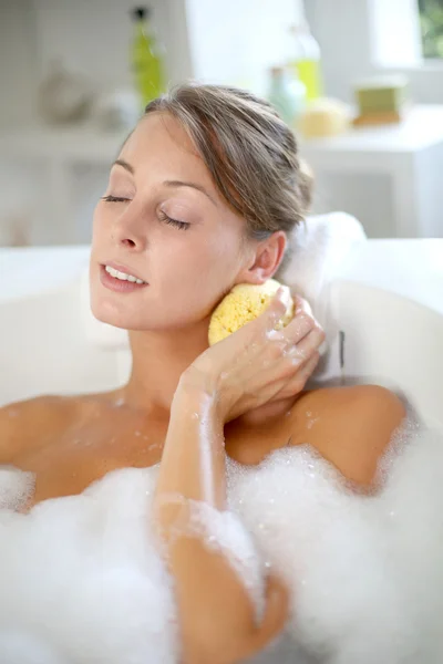 Beautiful woman relaxing in baththub Stock Image