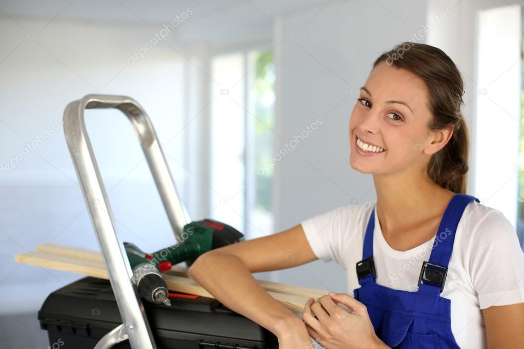 Cheerful young woman ready to reform house
