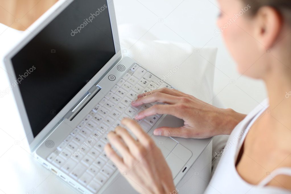 Closeup of woman using laptop computer