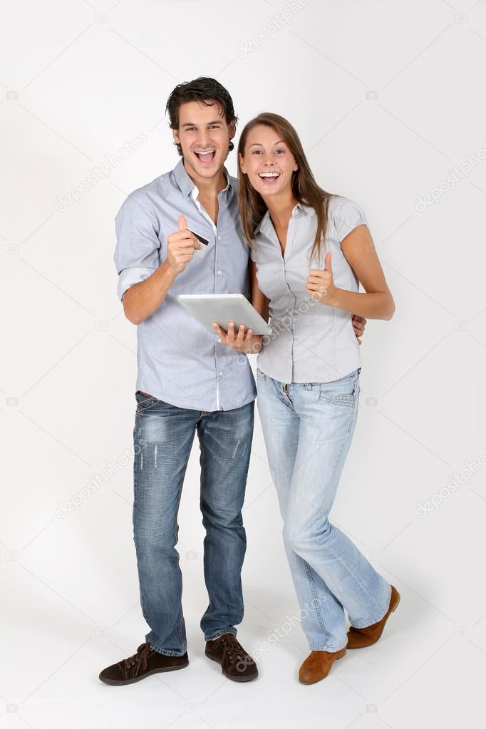 Young couple doing shopping on internet