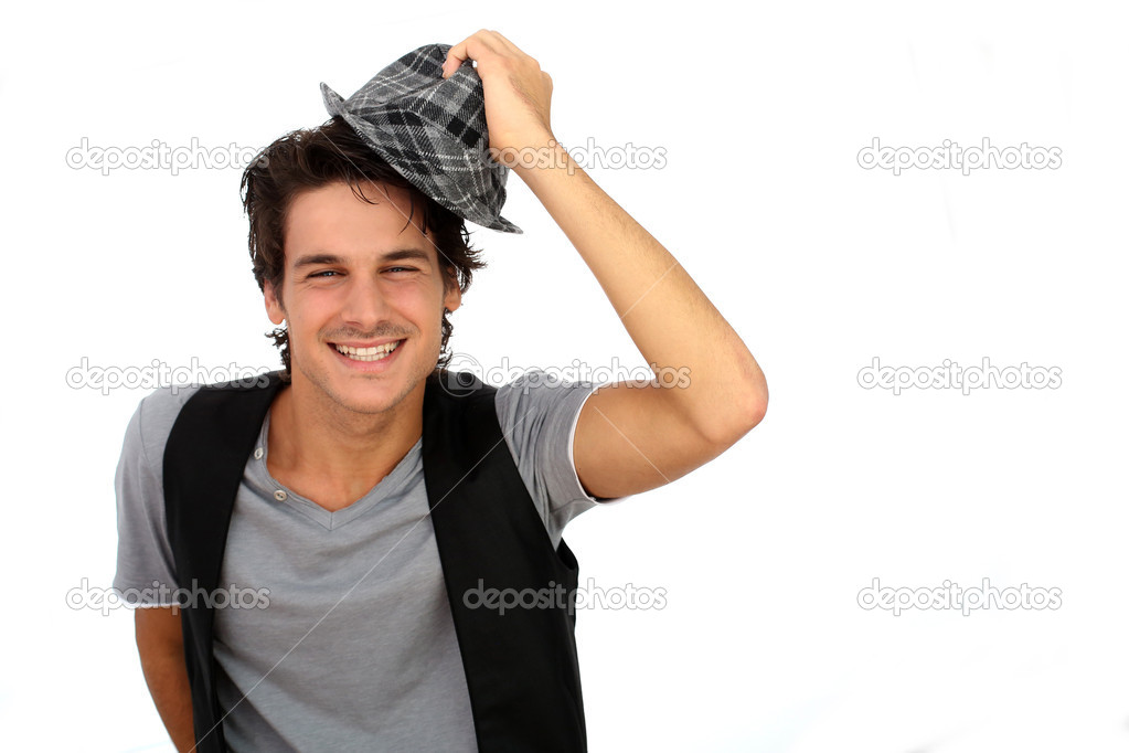 Cheerful guy wearing hat on white background