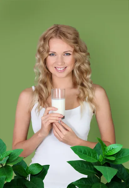 Portrait of woman holding glass of milk — Stock Photo, Image