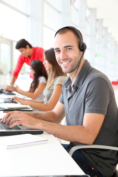 Customer service employee with headphones on