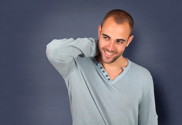 Handsome man standing on blue background — Stock Photo, Image