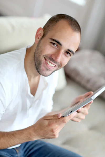 Closeup of handsome man websurfing on touchpad — Stock Photo, Image