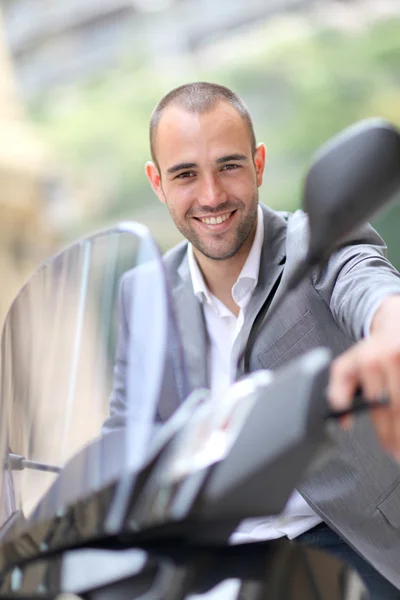 Man going to work on motorcycle — Stock Photo, Image