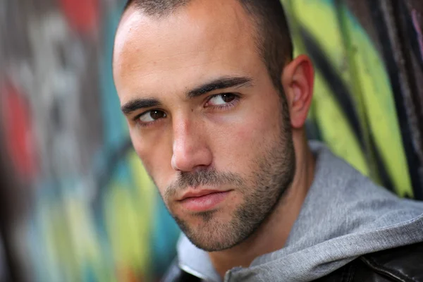 Portrait of bad boy in suburb street — Stock Photo, Image