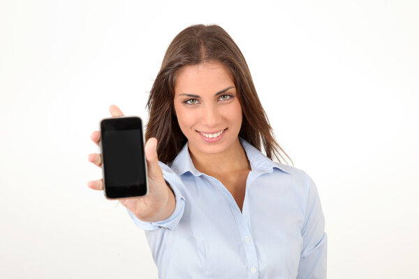 Portrait of beautiful young woman holding smartphone