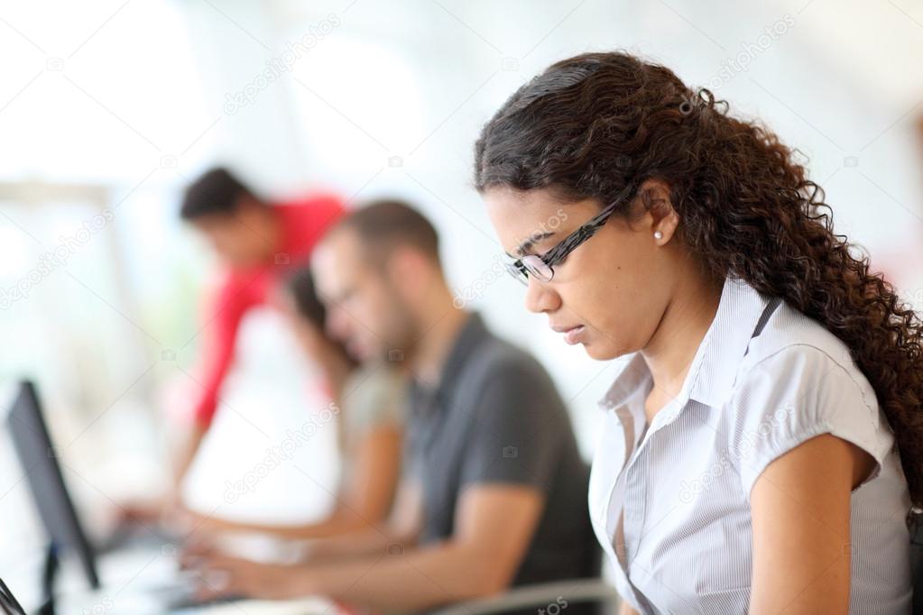 Portrait of student in front of laptop computer
