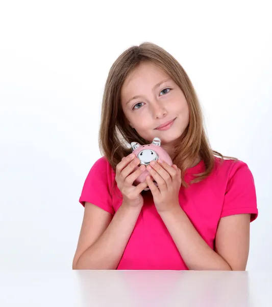 Lachende jong meisje houden piggy bank — Stockfoto