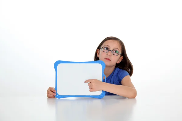 Cute little girl holding message board — Stock Photo, Image
