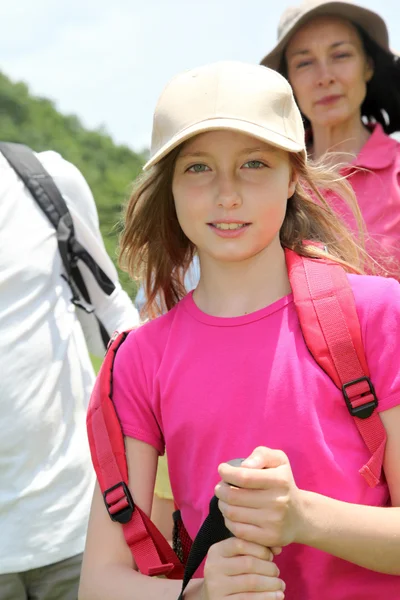 Portrait of young girl hiking with family — Stock Photo, Image