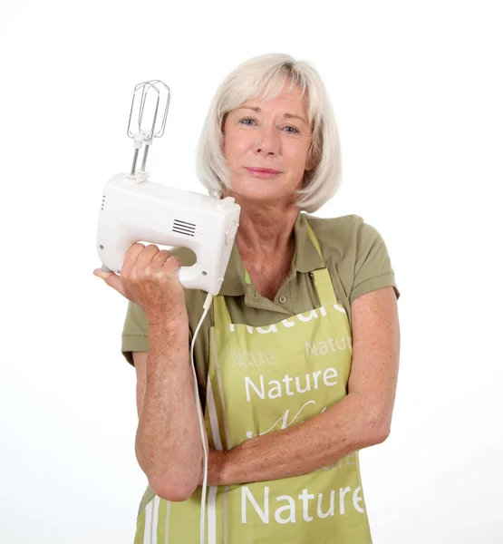 Portrait of senior woman holding mixer — Stock Photo, Image