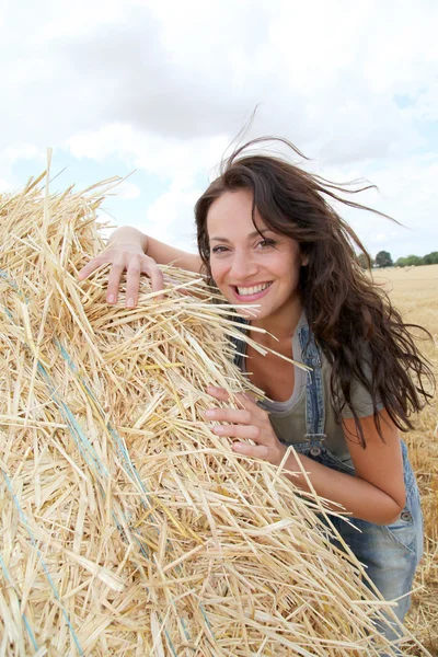 Beautiful woman laying down bale — Stock Photo, Image