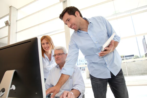 Senior attending business training — Stock Photo, Image