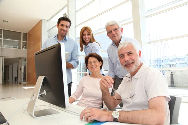 Senior attending business training — Stock Photo, Image